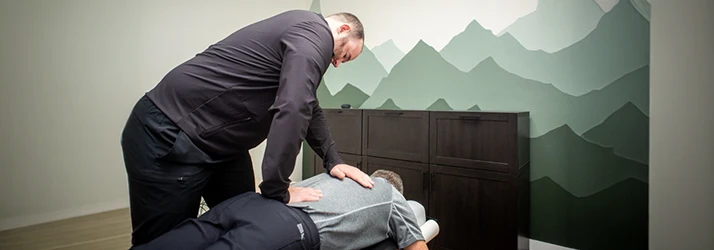 Cameron Beilke Adjusting Patient Back Chiropractic Care
