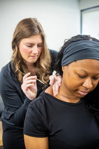 Hailey Alexander Performing Dry Needling on a Patient